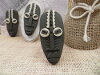 Bouton masque africain ovale allongé