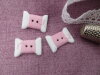 Bouton bobine fil rose