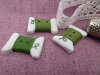 Bouton bobine fil vert feuille