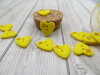 Bouton petit coeur jaune lumineux