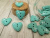 Bouton petit coeur turquoise