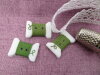 Bouton bobine fil vert feuille